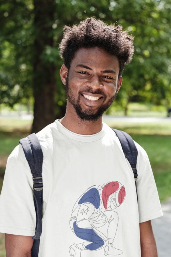 Young black man wearing a back pack and t-shirt with Lewis Hamilton celebrating in racing outfit