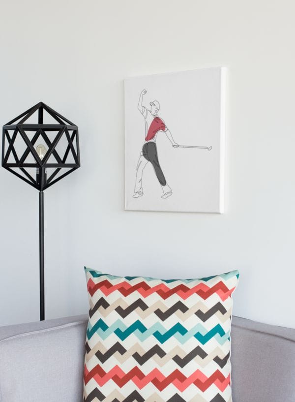 White wall canvas in living room of Tiger Woods fist pumping whilst holding putter