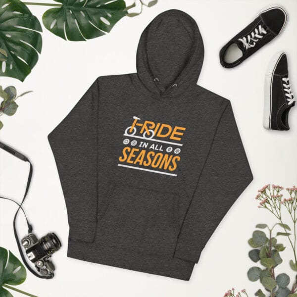 Unisex premium hoodie in charcoal heather with text "I ride in all seasons" with I and R making a bike