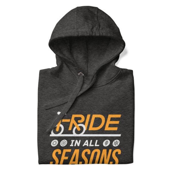 Folded premium hoodie in charcoal heather with text "I ride in all seasons" and small seasons icons