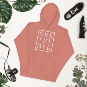 Unisex premium hoodie in dusty rose with white rectangle and letters "BRK THE MLD" meaning 'break the mould'