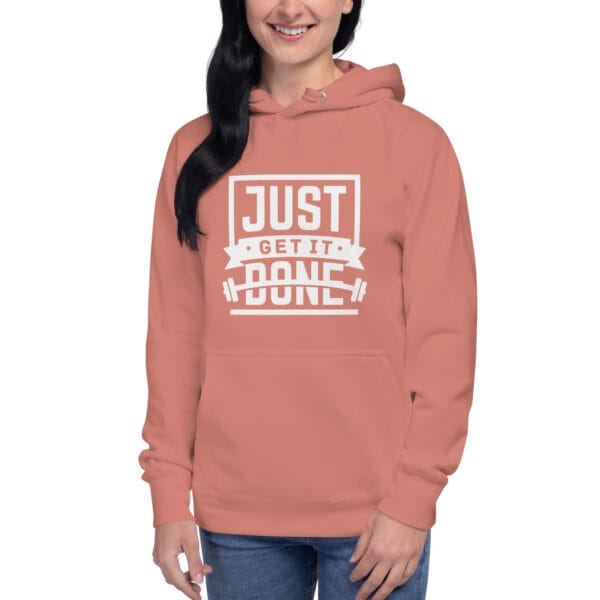 Young woman in dusty rose premium hoodie with white text "Just get it done" and barbell silhouette