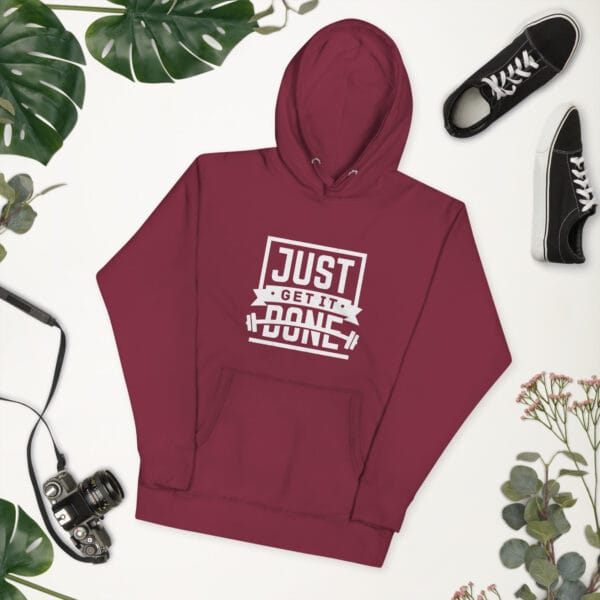 Unisex premium hoodie in maroon with white text "Just get it done" and barbell silhouette