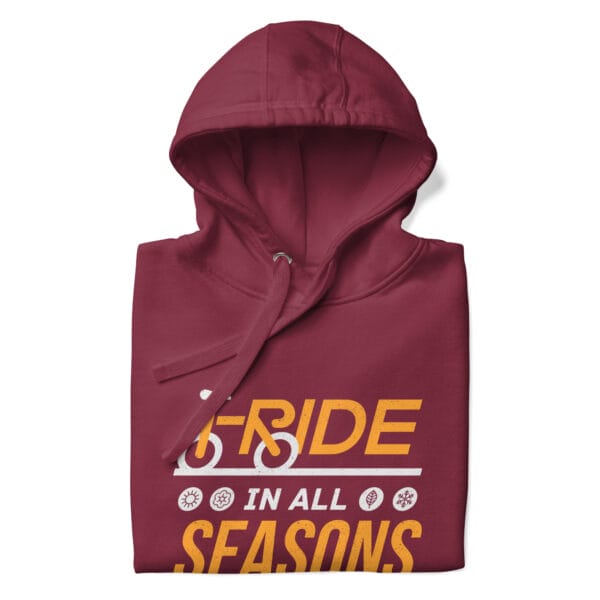 Folded premium hoodie in maroon with text "I ride in all seasons" and small seasons icons