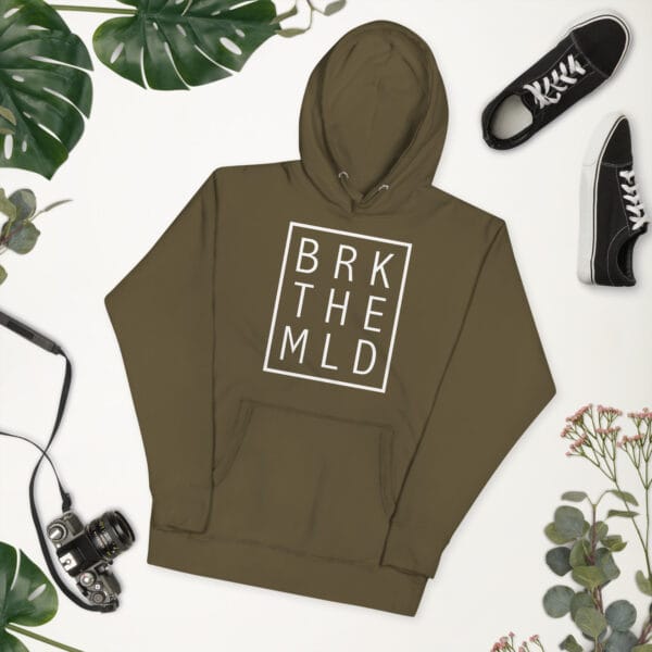 Unisex premium hoodie in military green with white rectangle and letter "BRK THE MLD" meaning 'break the mould'