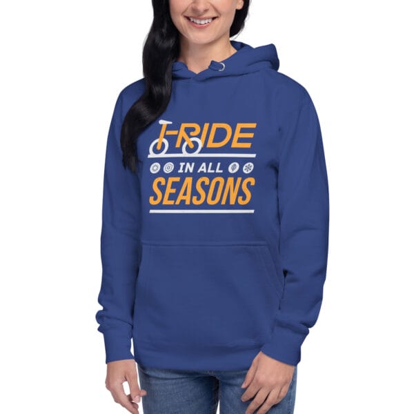 Young woman wearing premium hoodie in royal blue with text "I ride in all seasons" and small seasons icons