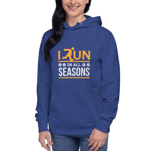 Young woman wearing premium hoodie in royal blue with text "I run in all seasons" with the letter R a silhouette of a runner