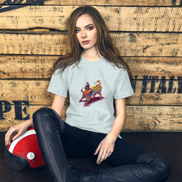 Young woman sat leaning against wall wearing ice blue t-shirt with max verstappen sat arms folded on top of a raging bull