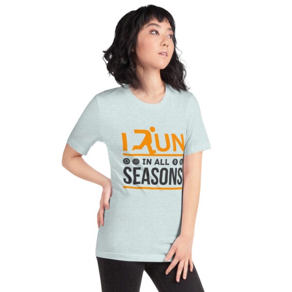 Young woman wearing a ice blue staple t-shirt with text "I run in all seasons" with the letter R a silhouette of a runner