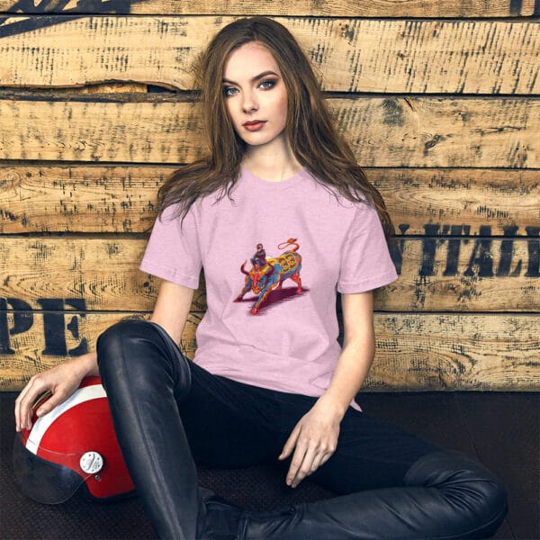 Young woman sat leaning against wall wearing prism lilac t-shirt with max verstappen sat arms folded on top of a raging bull