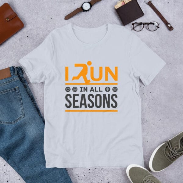 Unisex staple t-shirt in light blue with text "I run in all seasons" with the letter R a silhouette of a runner