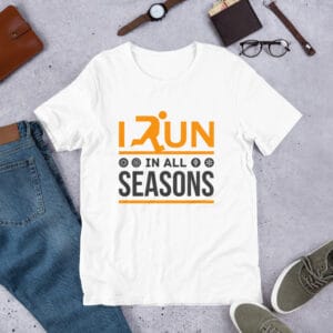 Unisex staple t-shirt in white with text "I run in all seasons" with the letter R a silhouette of a runner