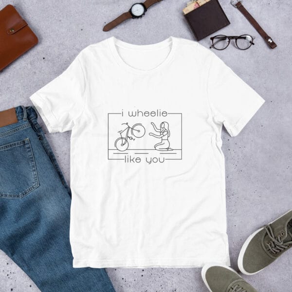 Unisex staple t-shirt in white with a bike and girl about to embrace with text "I wheelie like you"