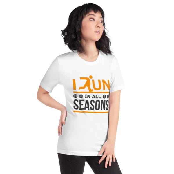 Young woman wearing a white staple t-shirt with text "I run in all seasons" with the letter R a silhouette of a runner