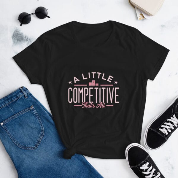 Women's short sleeve t-shirt in black with pink text "A little competitive that's all" with two small stars