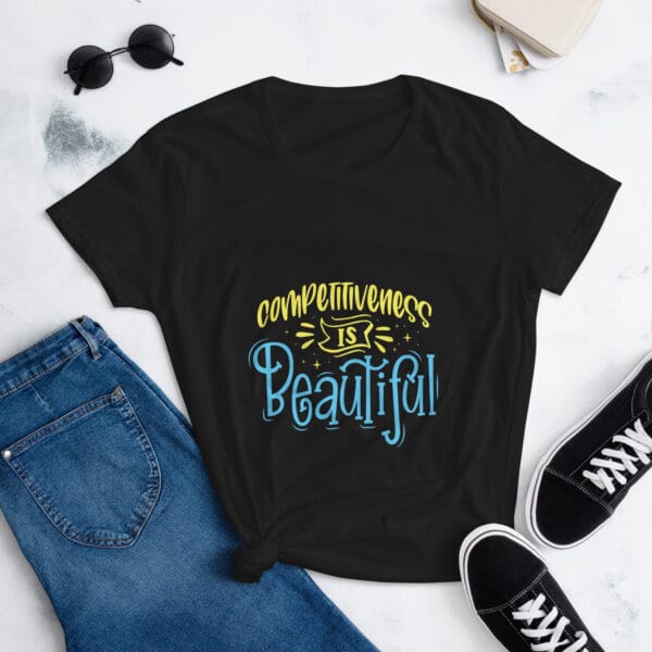 Women's short sleeve t-shirt in black with yellow and light blue text reading "competitiveness is beautiful"