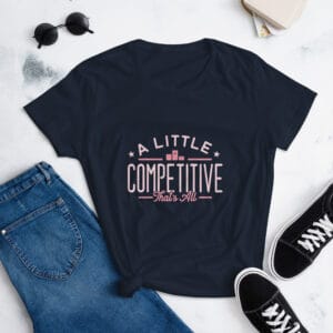 Women's short sleeve t-shirt in navy with pink text "A little competitive that's all" with two small stars