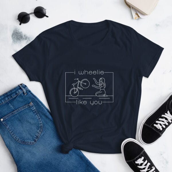 Women's shirt in navy with a bike and girl about to embrace with text "I wheelie like you"