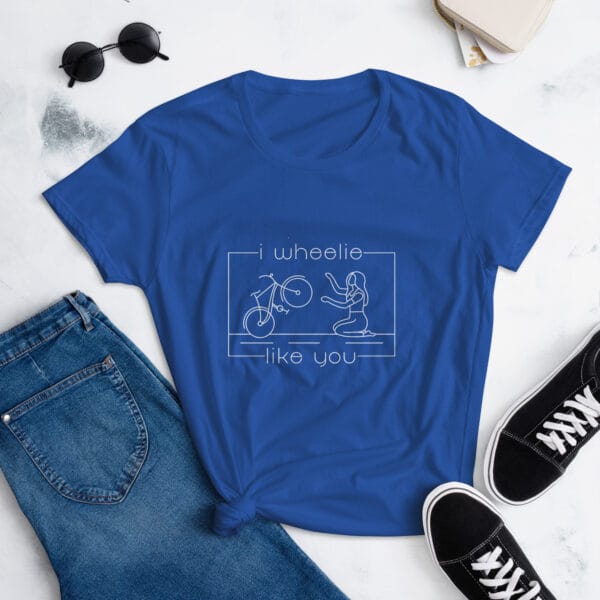 Women's shirt in royal blue with a bike and girl about to embrace with text "I wheelie like you"