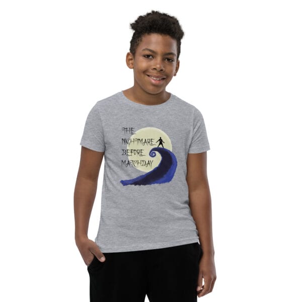 Young boy in athletic heather staple t-shirt with text 'The nightmare before matchday' and Ronaldo sii silhouette in front of moon