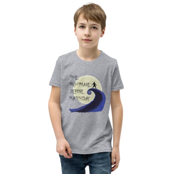 Young boy in athletic heather staple t-shirt with text 'The nightmare before matchday' and Ronaldo sii silhouette in front of moon