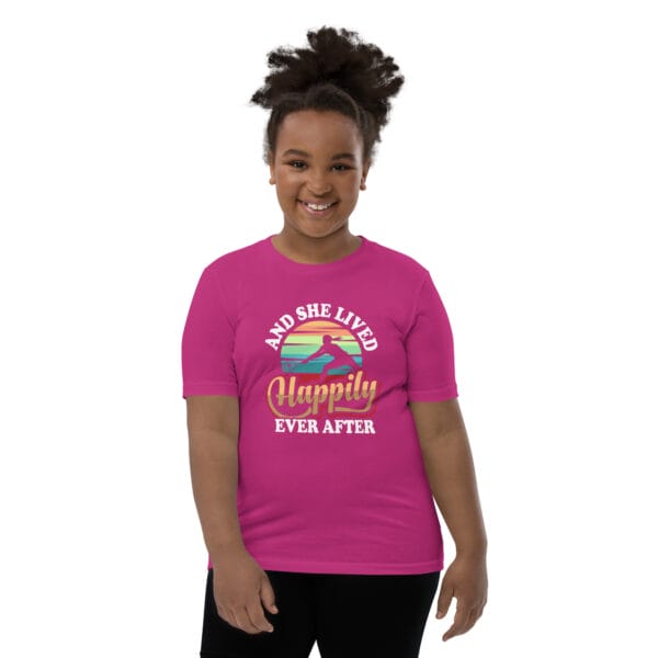 Young black girl wearing staple berry t-shirt with tennis player silhouette in front of colourful background and text 'And she lived happily ever after'