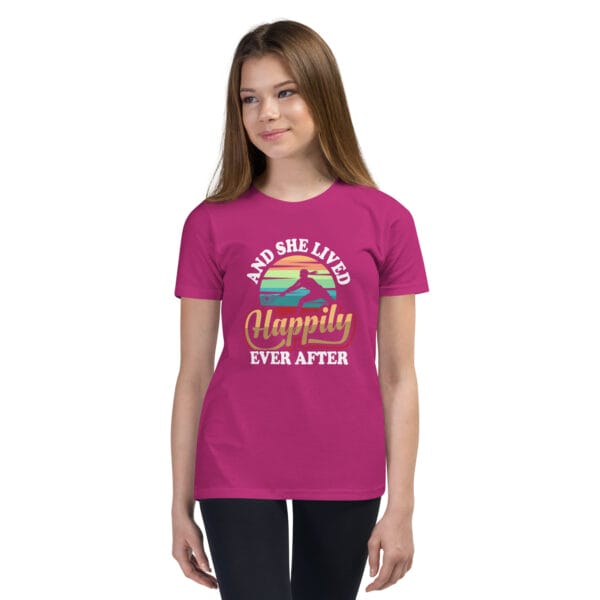 Young white girl wearing staple berry t-shirt with tennis player silhouette in front of colourful background and text 'And she lived happily ever after'