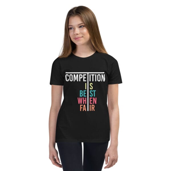 Young girl in black staple t-shirt with text 'Competition is best when fair'