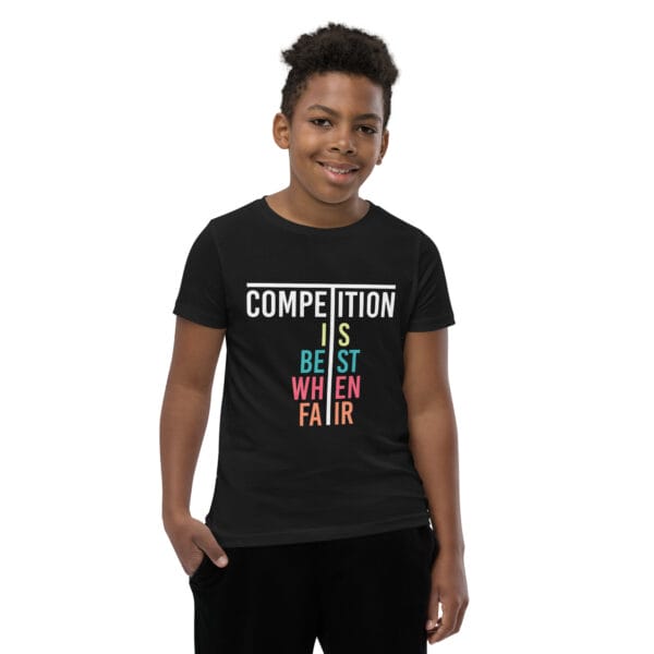 Young boy in black staple t-shirt with text 'Competition is best when fair'