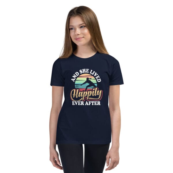 Young white girl wearing staple navy t-shirt with tennis player silhouette in front of colourful background and text 'And she lived happily ever after'