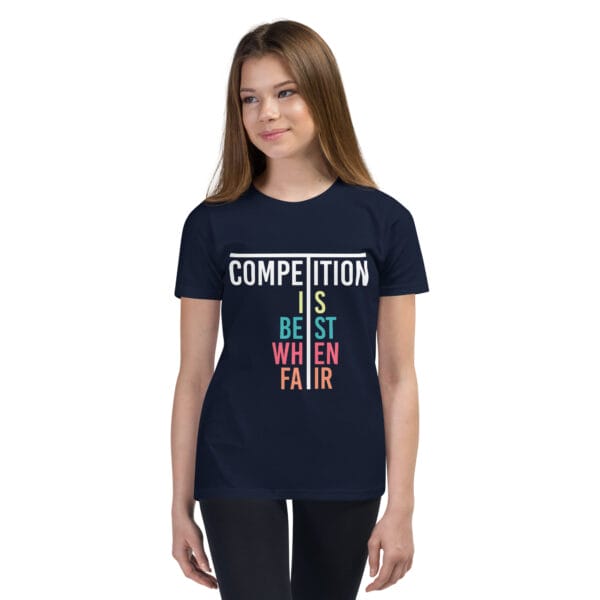 Young girl in navy staple t-shirt with text 'Competition is best when fair'