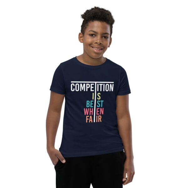 Young boy in navy staple t-shirt with text 'Competition is best when fair'