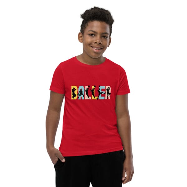 Young boy wearing staple t-shirt in red with the text 'baller' and black basketball player silhouettes in each letter