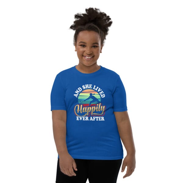 Young black girl wearing staple royal blue t-shirt with tennis player silhouette in front of colourful background and text 'And she lived happily ever after'