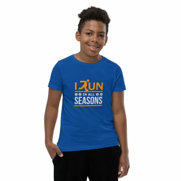 Boy wearing true royal staple t-shirt with text 'I run in all seasons' and small seasonal icons