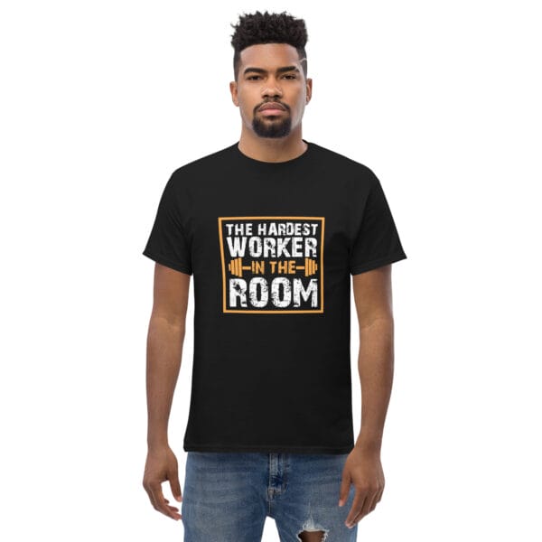 Man wearing black classic tee with text 'The Hardest Worker in the Room' and barbell