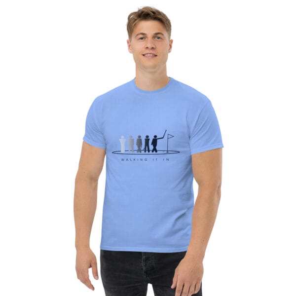 Man wearing a carolina blue classic t-shirt with silhouettes getting darker of a golfer walking in their putt