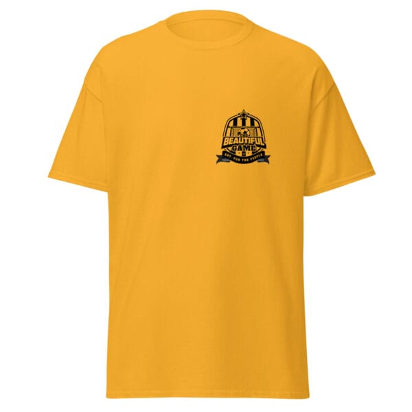 Men's classic tee in gold with small black the beautiful game crest on left side of chest