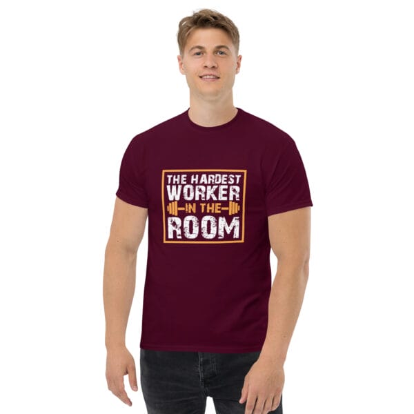 Man wearing maroon classic tee with text 'The Hardest Worker in the Room' and barbell