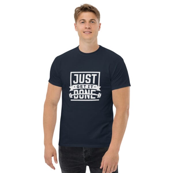 Man wearing a navy classic t-shirt with white text 'Just get it done' and a barbell