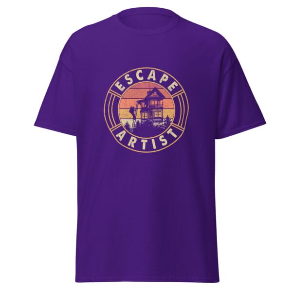 Men's classic tee in purple showing a golfer climbing down ladders from top floor of home with text 'Escape Artist'