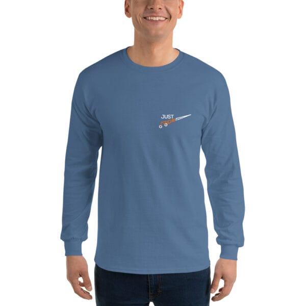 Man wearing indigo blue long sleeve t-shirt with text 'Just Ride' with letter R making a bike