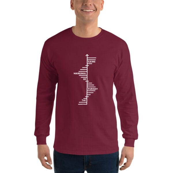 Man wearing a maroon long sleeve t-shirt with text 'The Pursuit of Marginal Gains' going up on small white steps