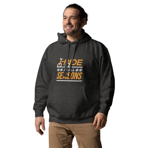 Man wearing premium hoodie in charcoal heather with text 'I ride in all seasons' and seasonal icons