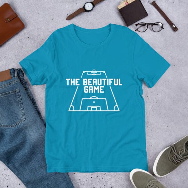 Men's staple t-shirt in aqua with white text 'The Beautiful Game' inside a football pitch