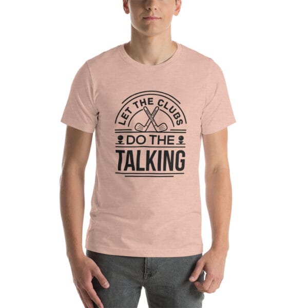 Man wearing unisex staple t-shirt in heather prism peach with text 'Let the clubs do the talking'