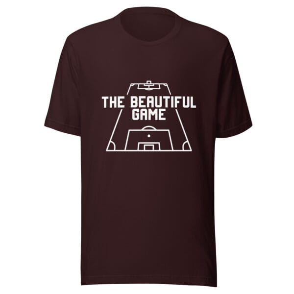 Unisex staple t-shirt in oxblood black with white text 'The Beautiful Game' inside a football pitch