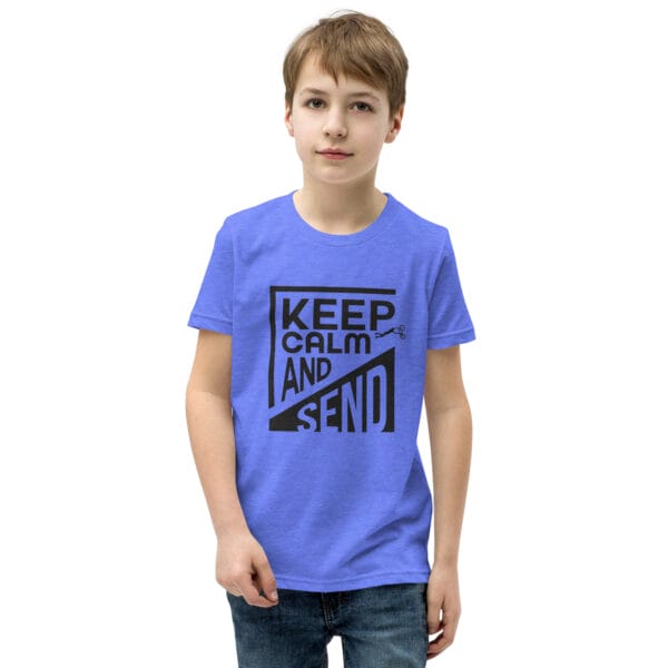 Boy in a heather columbia blue staple tee with black text 'Keep calm and send' and a small biker silhouette doing a superman