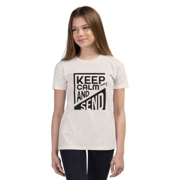 Girl in a heather dust staple tee with black text 'Keep calm and send' and a small biker silhouette doing a superman