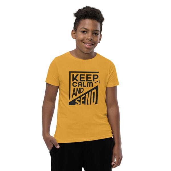 Boy in a mustard staple tee with black text 'Keep calm and send' and a small biker silhouette doing a superman